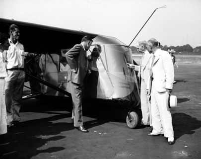 People examining the Waterman Arrowplane