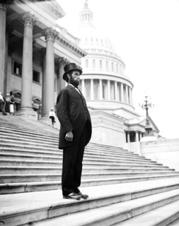 Person dressed as Abraham Lincoln on steps of U.S. Capitol