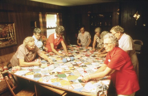 Senior citizens work hard on making a quilt in New Ulm