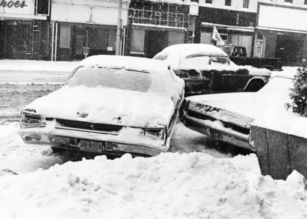 Snowbound Car Stuck Sideways on Street