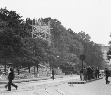 Street view of people waiting on a traffic island