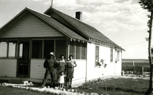 Family in front of house