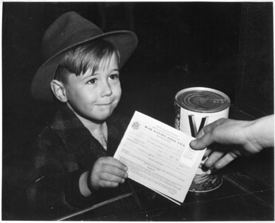 Young school boy uses War Ration Book