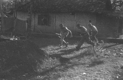 Soldiers seek cover; Date May 1946; Location Indonesia, Dutch East Indies