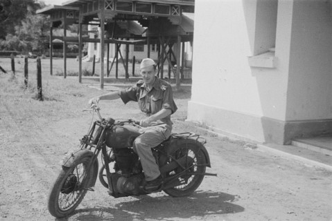 1947 - Motorcyclist; Man riding a motorcycle in Indonesia, Medan, Dutch East Indies, Sumatra