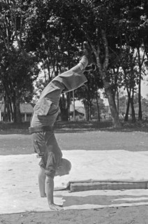 Dutch serviceman does handstand; Date June 1947; Location Indonesia, Dutch East Indies