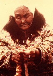 Early 1970s - Elderly Eskimo woman trimming seal intestines