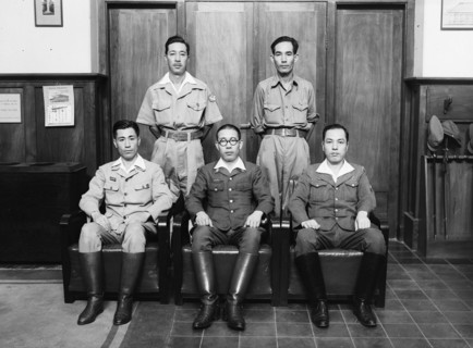 Dutch East Indies - Five Japanese soldiers in an office; on the left the Djawa Calendar ca. 1942