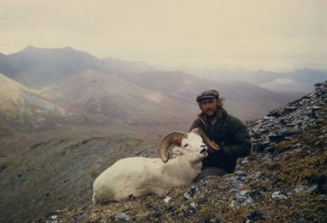 July 1974 - Hunter holding head of Dall sheep ram shot near July Creek, Alaska