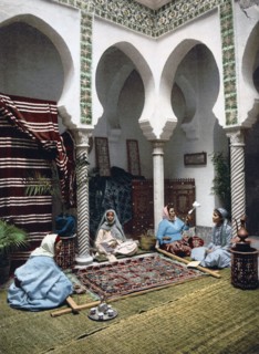Moorish women making Arab carpets, Algiers, Algeria ca. 1899