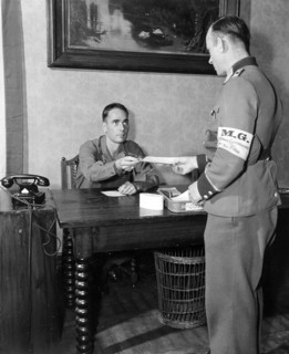 Sergeant Francis J. Walsh Gives Instructions to a German Master Sergeant in Uniform ca. 6/1945