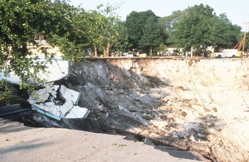 Winter Park Florida Sinkhole of 1981 - Remnants of community pool in sinkhole. View to east across the sinkhole.