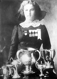 Alsie Aykroyd in front of her trophies 7 13 1910