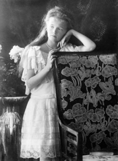 Grand Duchess Olga, leaning against chair