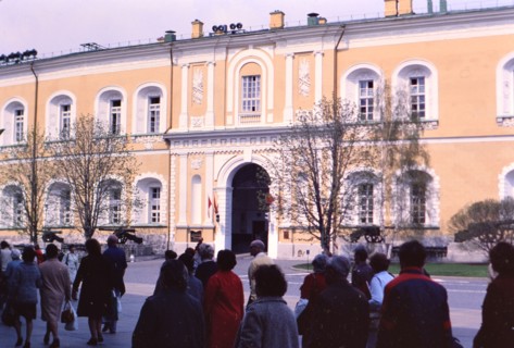 Pedestrians outside of a building on a cool spring day in a major city in Russia in late 1970s (1978)