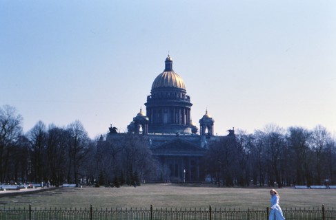 Woman walking outside a building in 1970s Russia (ca. 1978)