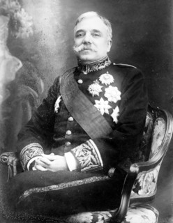 Campos Henriques, Minister of Justice, Portugal, seated, in uniform