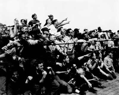 (5 May 1961) Crew members of the U.S. Navy Carrier Champlain cheer and take pictures of the arrival of the first Project Mercury pilot to fly a suborbital flight, astronaut Alan B. Shepard Jr.