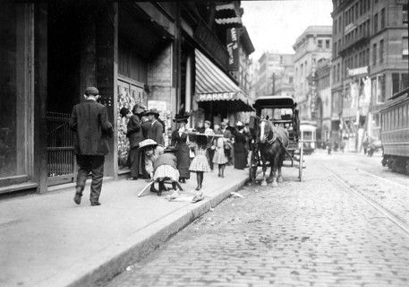 Little girl woodpickers making up a load. Boston, Mass, October 1909