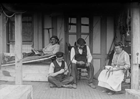 Family on a porch of a home in Broad Channel, Queens ca. 1910-1915