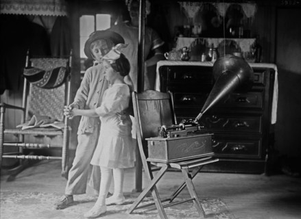 Boy and a girl dancing while an Edison Home Phonograph plays in a house in Broad Channel, Queens ca. 1910-1915
