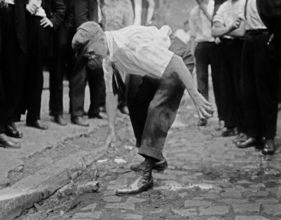 Bayonne oil workers striking, picking up stones to throw at guards ca. 1915-1916