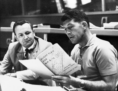 (19 Sept. 1962) Astronaut Walter M. Schirra Jr, (right), Mercury-Atlas 8 (MA-8) pilot, discusses the MA-8 flight plan with flight director Christopher C. Kraft Jr., Chief of the Flight Operations Divi...