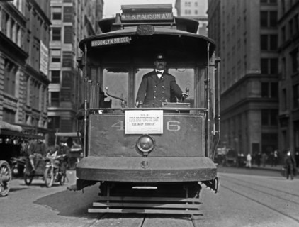 A street car with sign 'This is fire prevention day, clean up rubbish' in New York City - October 9, 1914