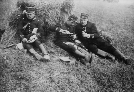 French soldiers eating and drinking wine in a field probably during World War I ca. 1914-1915