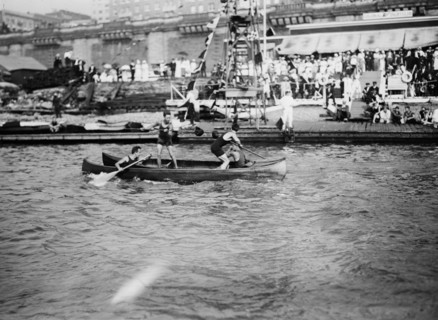 Men enjoying the summer fun of canoe tilting ca. 1910-1915