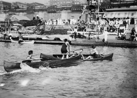 Men enjoying the summer fun of canoe tilting ca. 1910-1915