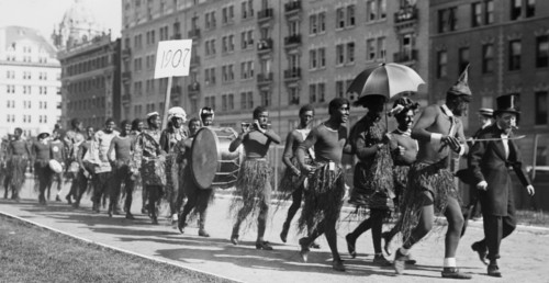 Columbia University students dress up as Zulu warriors (original caption identifies the students as Zulu savages with missionary) ca. 1910-1915