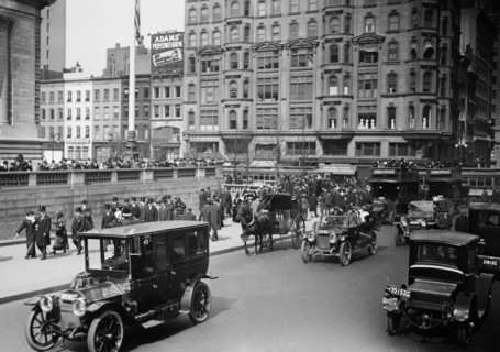 Cars driving down Fifth Avenue in New York City on Easter Sunday 1913