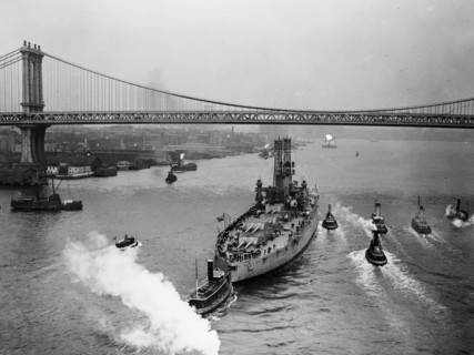 USS Wyoming (BB-32) Battleship, the Manhattan Bridge seen in the background ca. 1910-1915