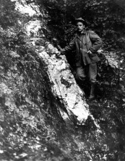 In this photo, taken on Sept 11, 1911, we see a prospector standing next to a gold-bearing quartz vein on the property of the Seward Bonanza Gold Mines Co.,