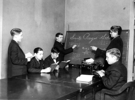 Teacher and five boys in Senate Pages' School - boy typing ca. 1909-1932