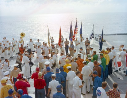 (21 July 1966) The crew of the Gemini-10 spaceflight, astronaut John W. Young (left), command pilot, and Michael Collins, pilot, talk on live radio and television during welcome aboard ceremonies on t...