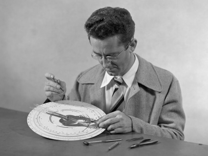 Technician at work adjusting an unidentified mechanical computing device. ca. 1949