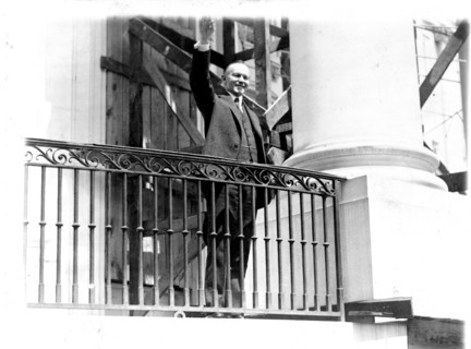 President Coolidge waving a greeting to the throngs of children gathered in the White House grounds to roll Easter eggs April 18, 1927