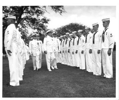 Air Station Barbers Point, Hawaii Original photo caption: 'Rea Admiral S. H. Evans, Commander of the 14th Coast Guard District, inspects personnel attached to the Coast Guard Air Detachment, Barbers P...