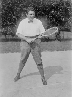 Photograph shows Irish American tenor singer John McCormack (1884-1945) playing tennis