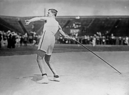 Olympic track and field athlete Platt Adams participating in a javelin throw event ca. 1910-1915