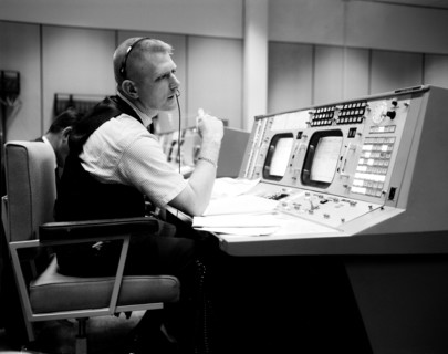 (April 1965) Prior to the Gemini-Titan 4 mission, flight director Eugene F. Kranz is pictured during a simulation at the Flight Director console in Houston's Mission Control Center on the Manned Space...