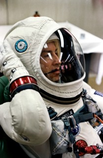 Astronaut James A. Lovell Jr., pilot of the Gemini-7 spaceflight, relaxes in the suiting up trailer at Launch Complex 16, during the Gemini-7 prelaunch countdown