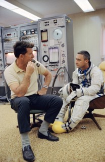 (23 March 1965) Astronaut Virgil I. Grissom (right), the command pilot of the Gemini-Titan 3 three-orbit mission, is shown with astronaut Walter M. Schirra Jr. in the ready room at Pad 16.