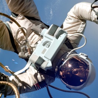 Astronaut Edward H. White II, pilot of the Gemini IV four-day Earth-orbital mission, floats in the zero gravity of space outside the Gemini IV spacecraft. (June 1965)