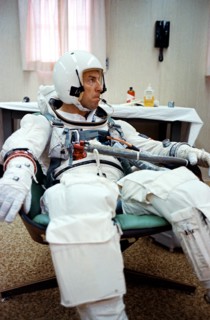 (4 Dec. 1965) Gemini-7 pilot James A. Lovell Jr. has a temperature check with an oral temperature probe attached to his spacesuit during a final preflight preparations for the Gemini-7 space mission.
