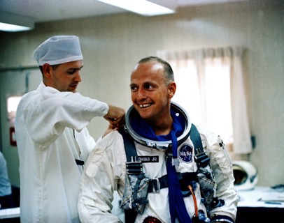 (12 July 1965) Astronaut Charles Conrad Jr. receives assistance with his pressure suit during suiting up and ingress test activity at Pad 16, Cape Kennedy, Florida in preparation for Gemini-5 spacefli...