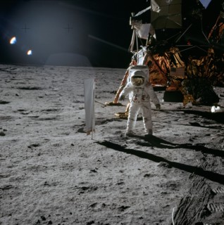 (20 July 1969) Astronaut Edwin E. Aldrin Jr., lunar module pilot, is photographed during the Apollo 11 extravehicular activity (EVA) on the lunar surface. In the right background is the lunar module.