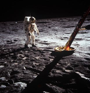 (20 July 1969) Astronaut Edwin E. Aldrin Jr., lunar module pilot, walks on the surface of the moon near a leg of the Lunar Module during the Apollo 11 extravehicular activity (EVA).